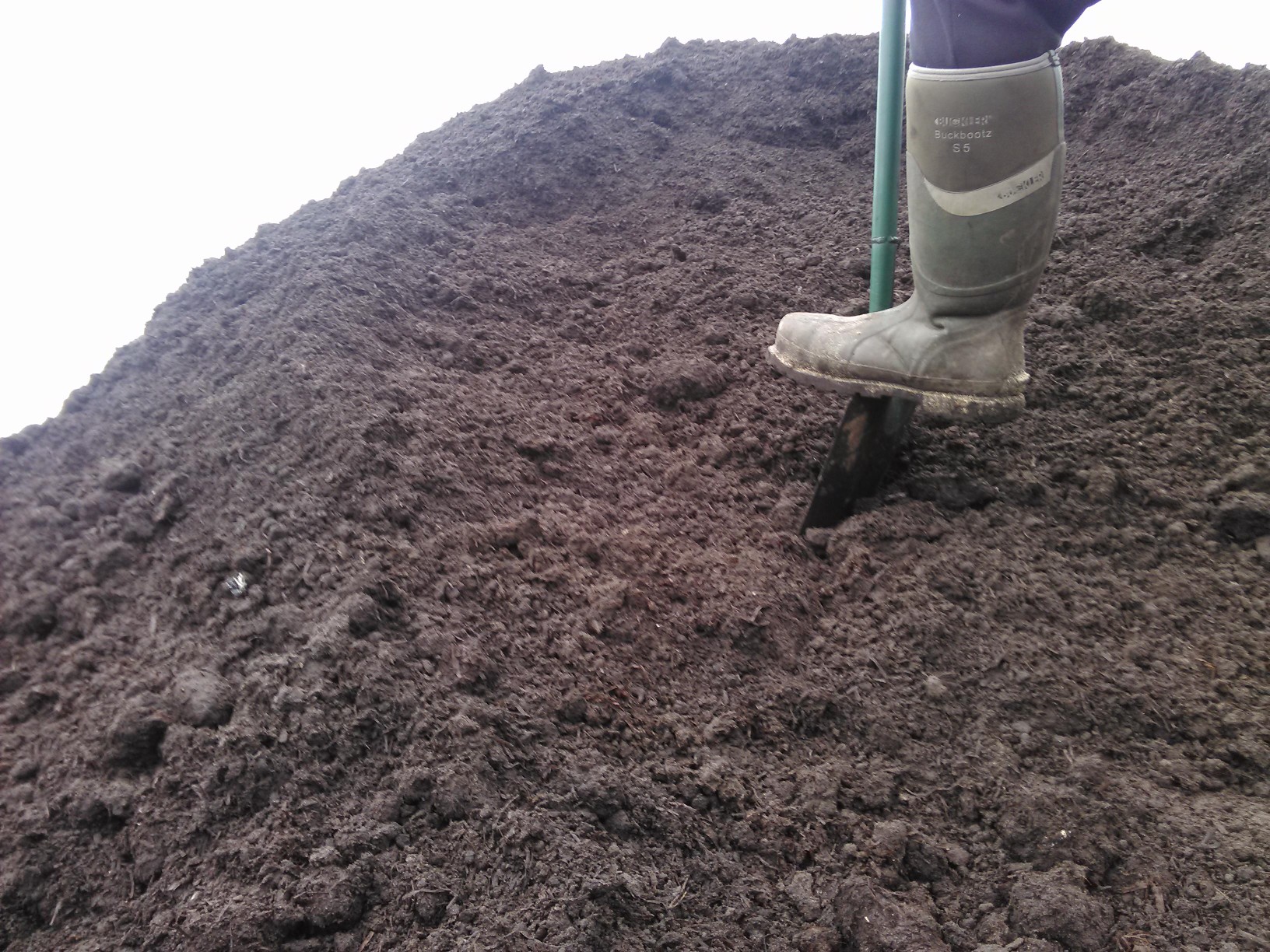 Large topsoil bags ready for crane truck delivery